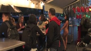 Busty naked slut handcuffed in public