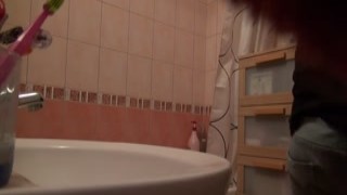 Cute blonde masturbates during her hot shower