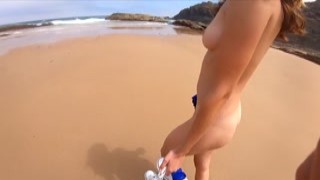 kiss1couple - Handjob on the beach behind the rocks